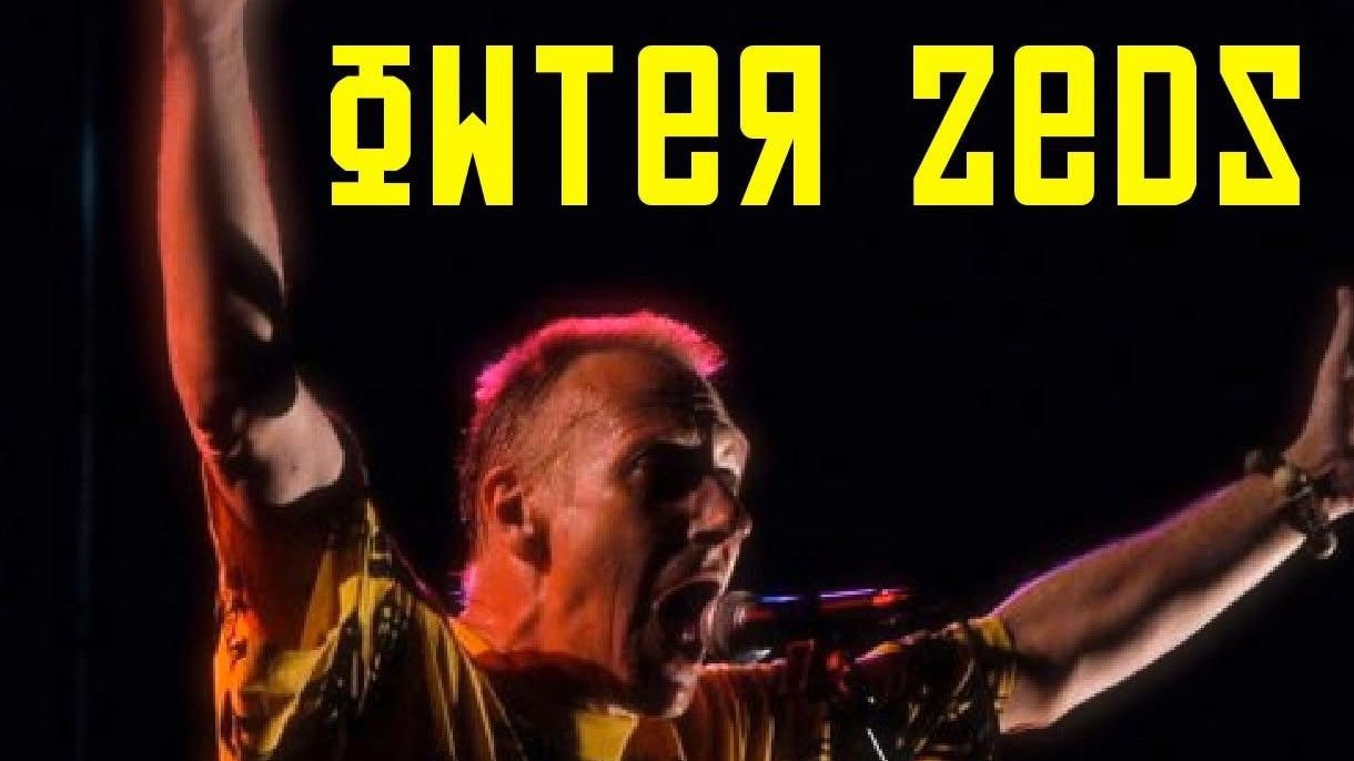 A picture of someone singing into a microphone with arms raised. Stylised text saying 'Owter Zeds' is above them.
